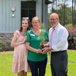 East GA State President with Erin Youmans Holding Moon Tree